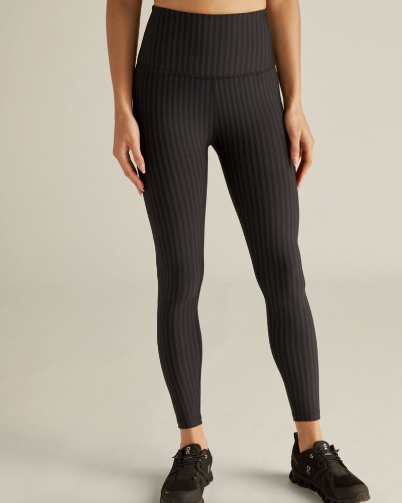 Front of a model wearing a size Large Spacedye High Waist Legging in Black Striped Jacquard in Black Striped Jacquard by Beyond Yoga. | dia_product_style_image_id:345348